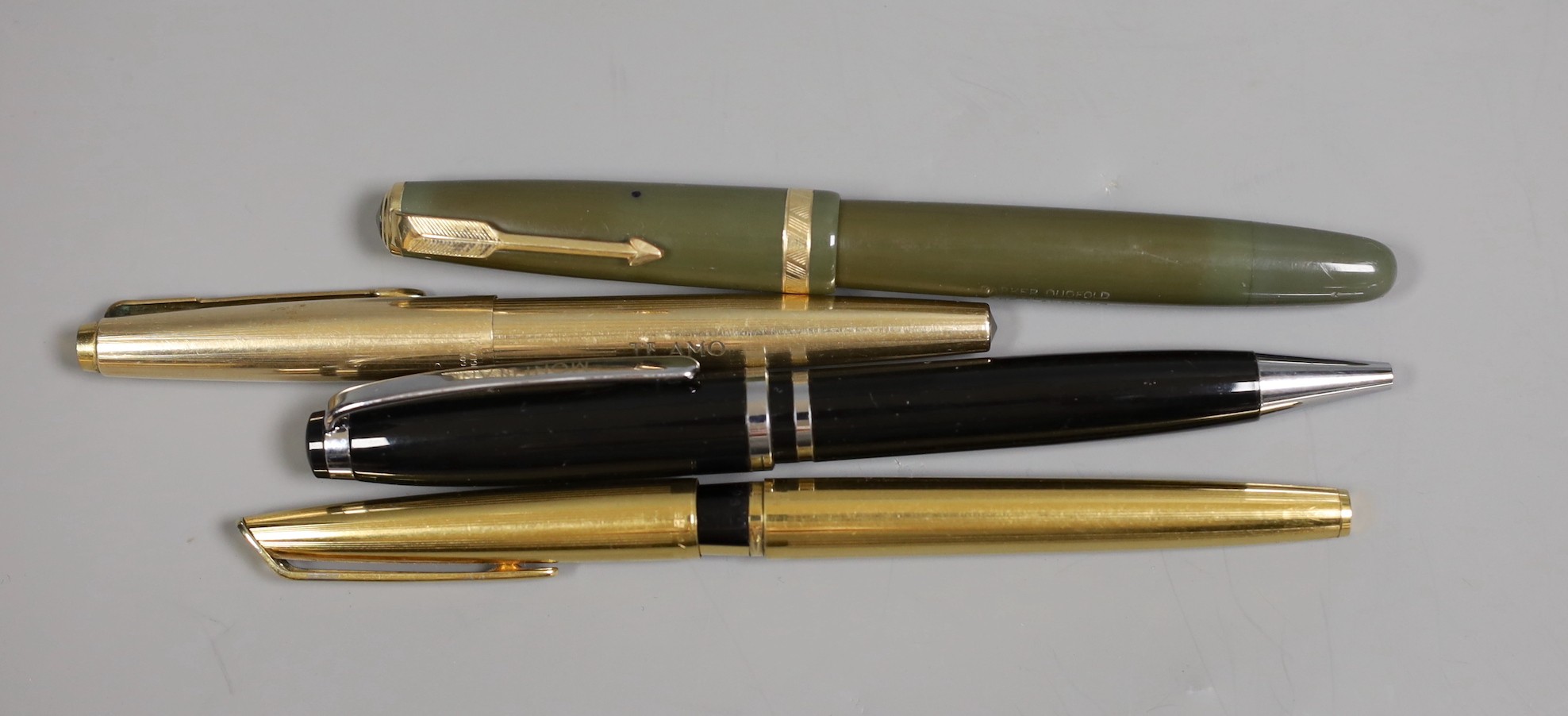 A Montblanc ballpoint pen, a Parker Duofold fountain pen, a C F Waterman and another rolled gold pen